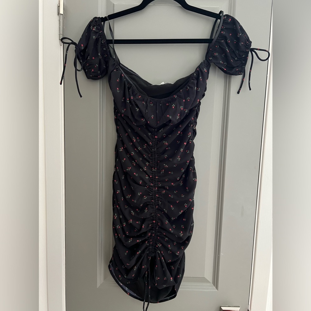 More To Come black dress. Roses. Cinched sides. Size XS. Detailed sleeves.